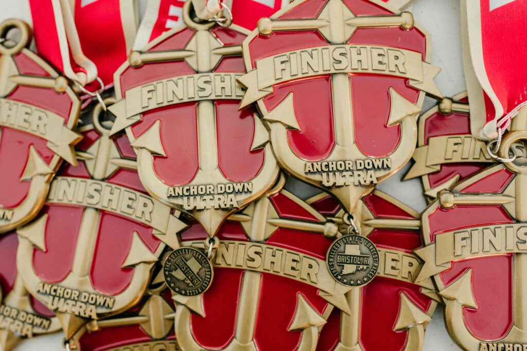 A collection of finisher's medals from the Anchor Down Ultra Marathon.